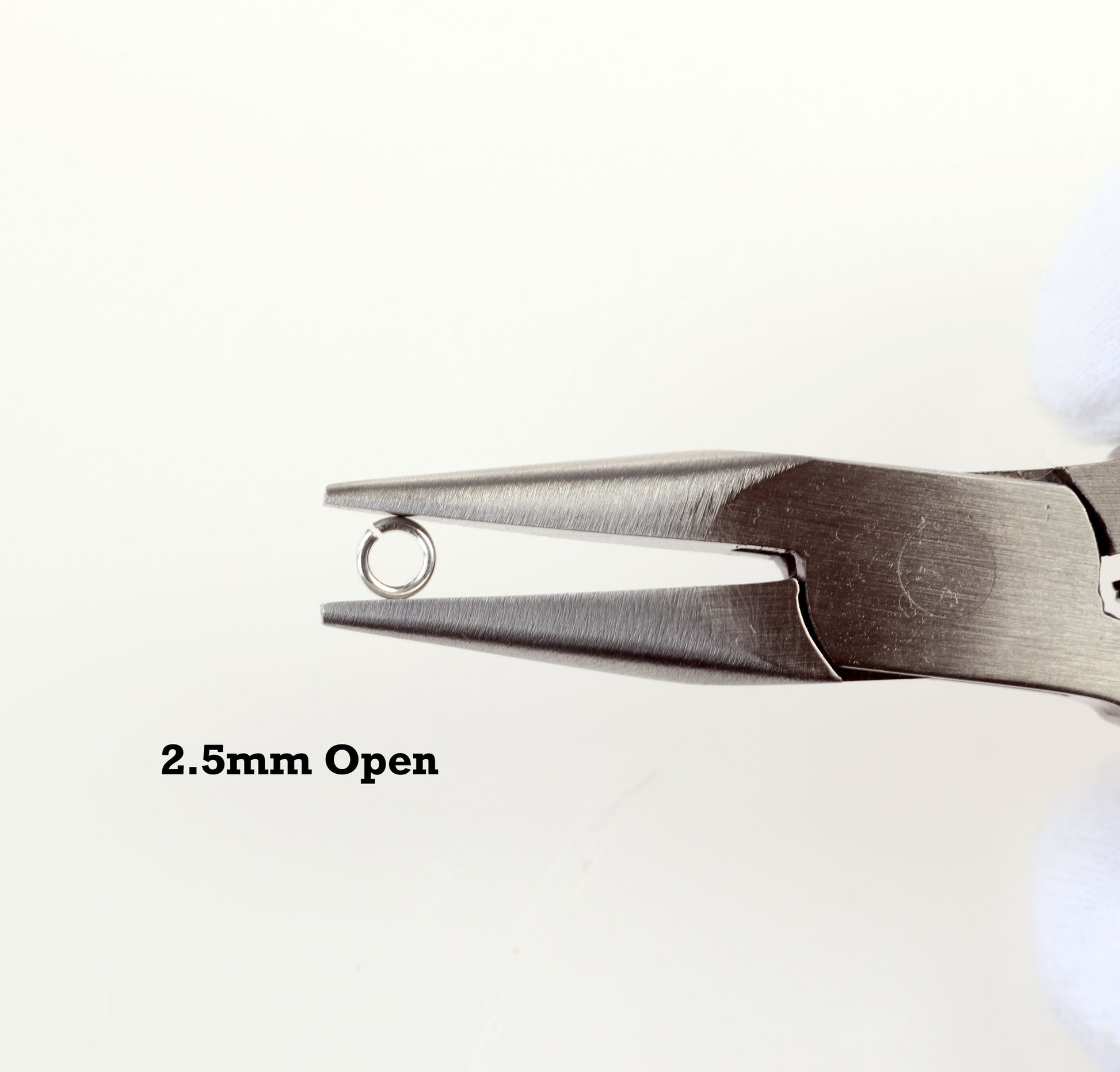 Jewelry Pliers displaying 1 2.5mm Open Jump Ring, Tumbled & Polished Argentium 940 Silver, Handmade