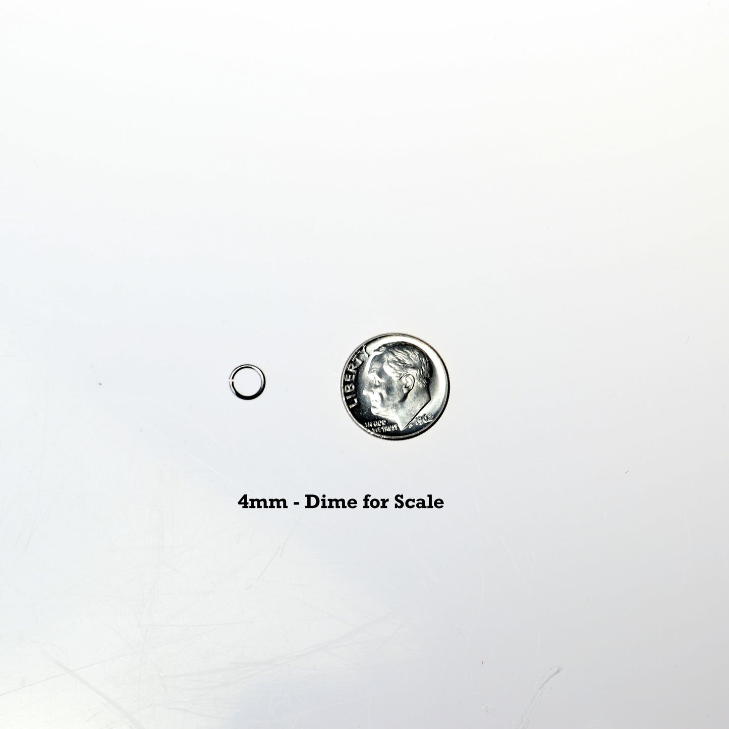 4mm open ring shown next to dime for scale.