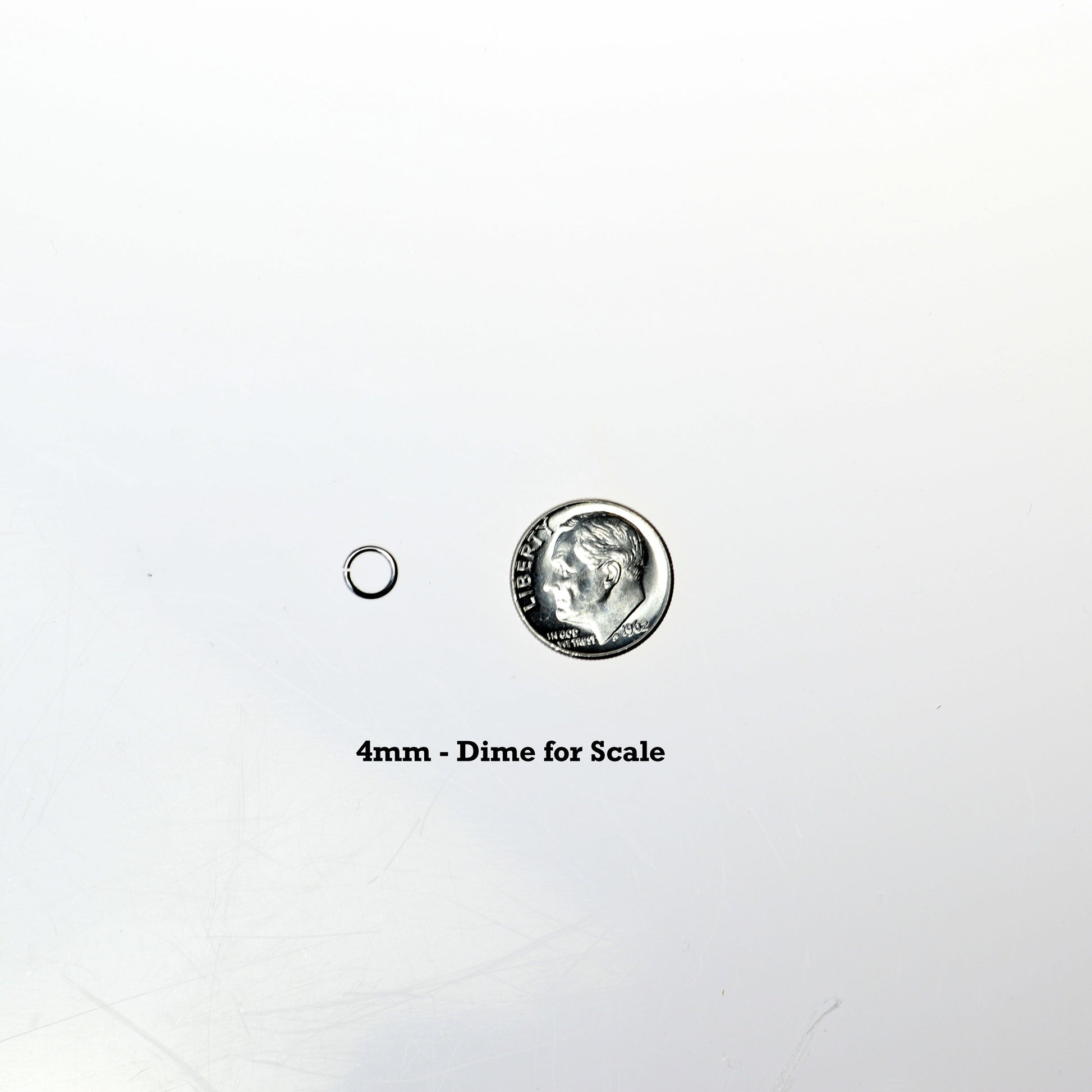 4mm open ring shown next to dime for scale.