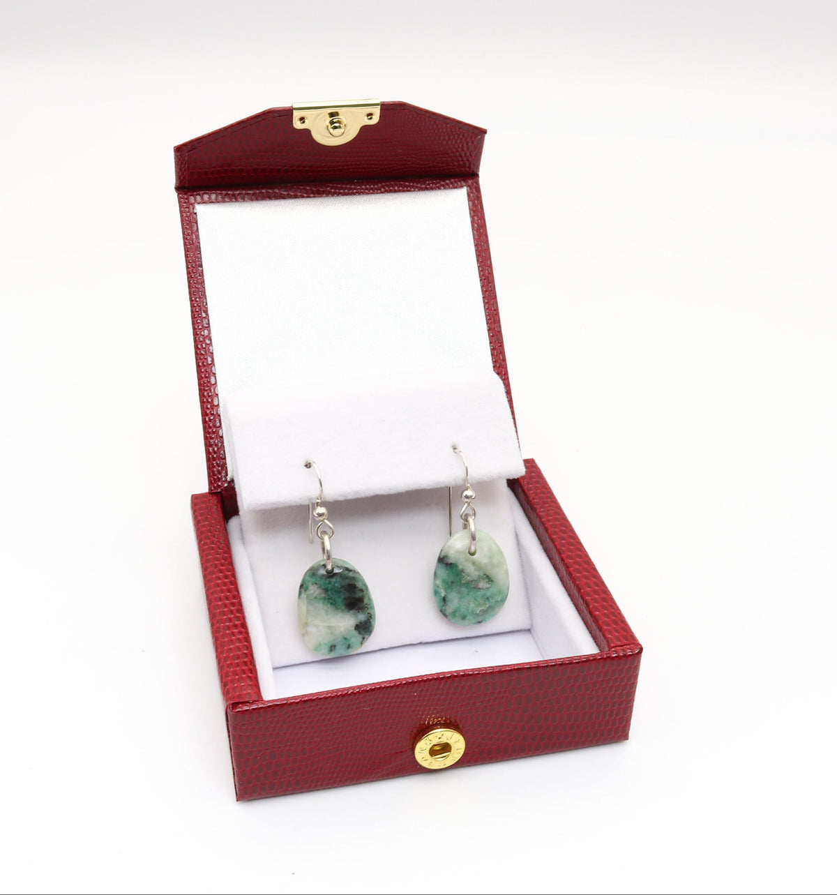 Handmade African Turquoise Jasper dangle earrings shown in red and white gift box with gold snap feature against white background.