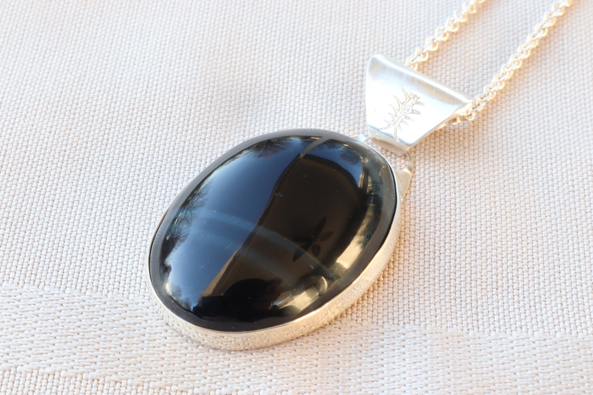 A rare African Blue Tiger's Eye gemstone handcut and polished in our Missouri studio. This one-of-a-kind gem is meticulously fashioned in Argentium 935 Silver  The African Blue Tiger's Eye cabochon with unique coloring and blue striped patterns, making this piece one-of-a-kind.
▪️Eco-Friendly: The materials used are eco-friendly and nature-friendly. Argentium Silver is made from 100% recycled silver.