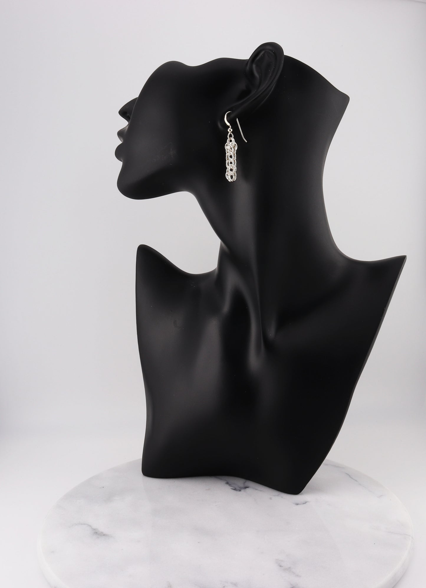 handcrafted Full Persian Weave dangle earrings, meticulously crafted from premium 935 Argentium® Silver. Featuring interlocking links in a mesmerizing chainmail pattern, these earrings showcase exceptional craftsmanship and design.