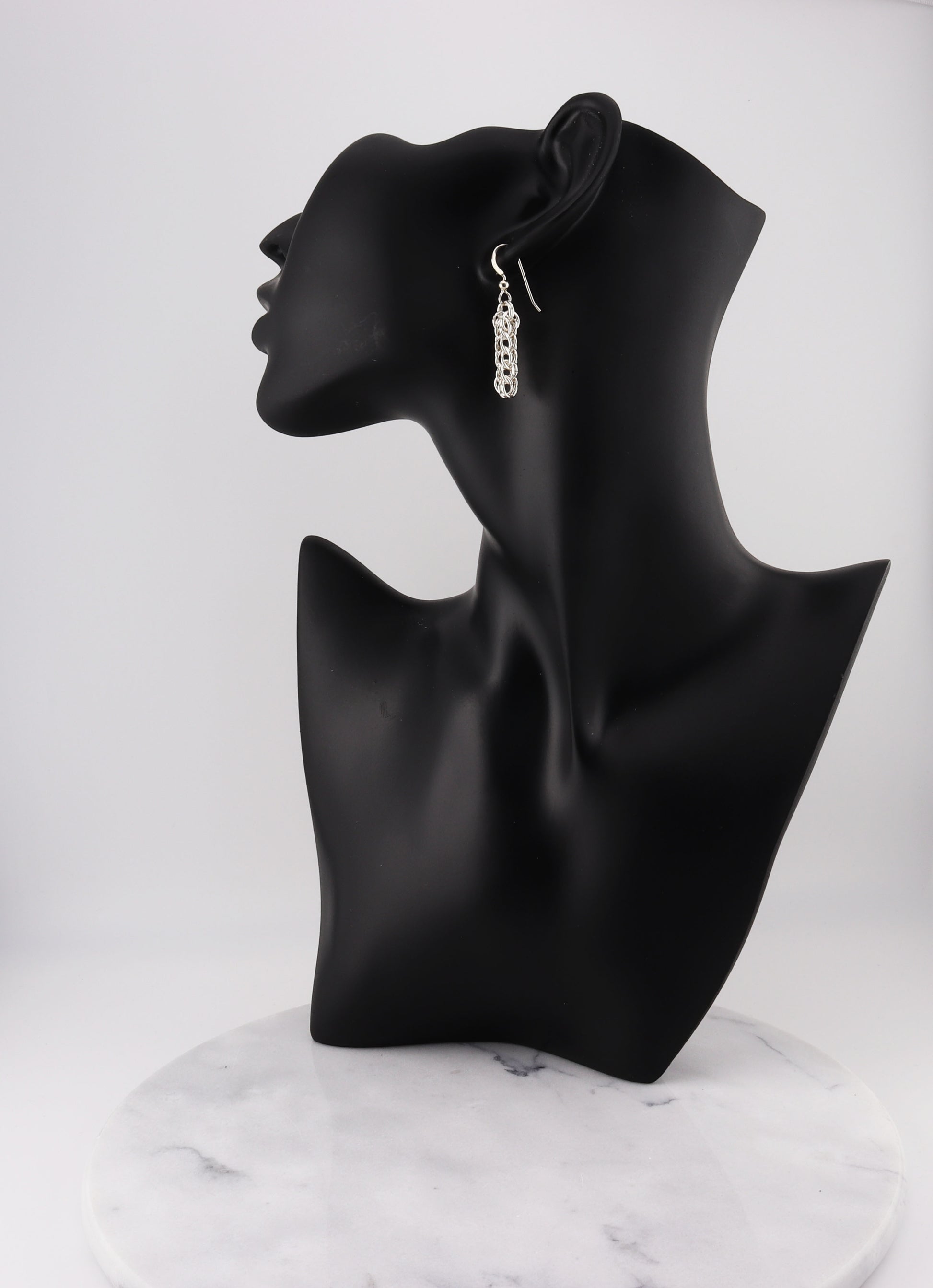 handcrafted Full Persian Weave dangle earrings, meticulously crafted from premium 935 Argentium® Silver. Featuring interlocking links in a mesmerizing chainmail pattern, these earrings showcase exceptional craftsmanship and design.