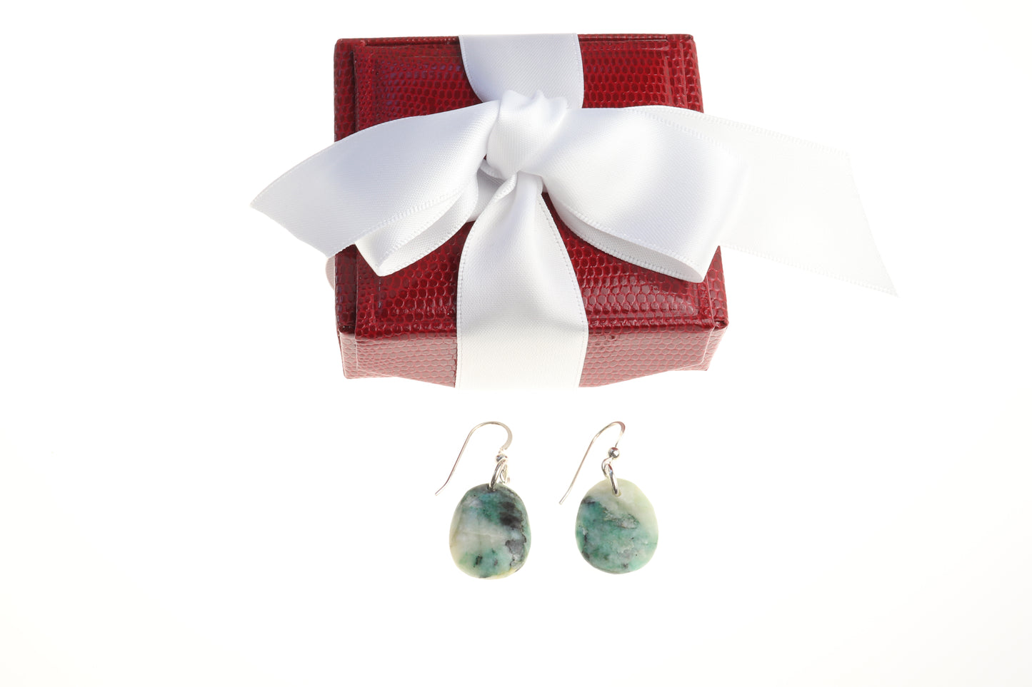 Natural African Turquoise tear drop earrings, handcut and polished in our Missouri studio to reveal earthy patterns and hues of teal, green and creamy white. Reminiscent of real turquoise, African Turquoise boasts its own unique patterns and variations, making every piece truly one-of-a-kind. The sterling 935 Argentium® Silver ear wires, add a touch of elegance, ensure a comfortable and secure fit and are hypoallergenic. Ready to Gift in a red faux leather gift box with white sating bow.