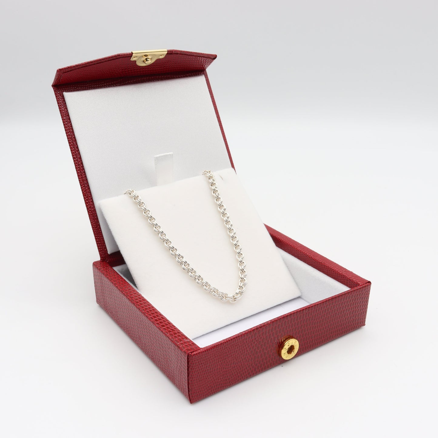 A 24-inch double link sterling 940 Argentium solid silver cable chain, shown on white background packaged in red faux leather gift box.