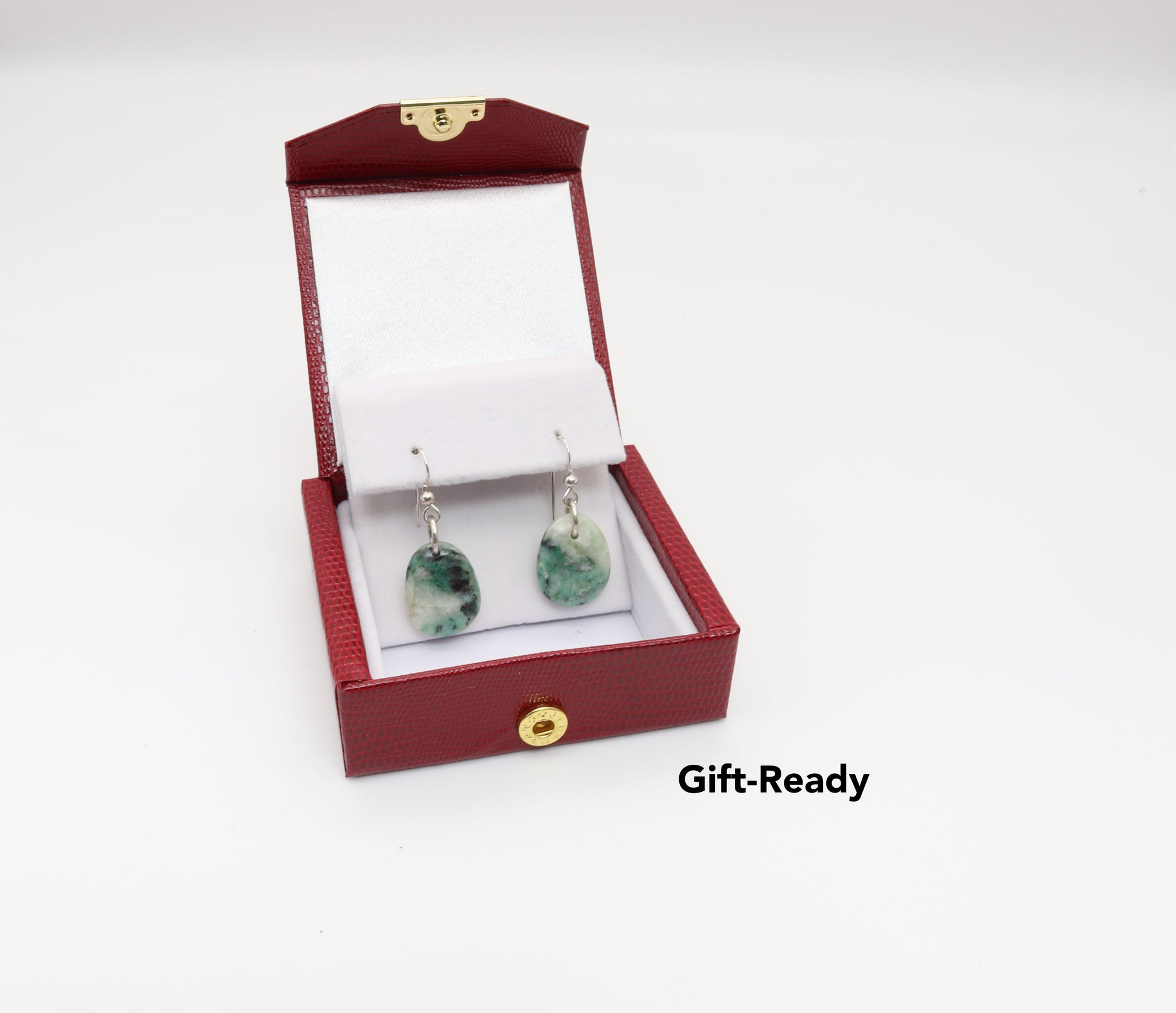 Natural African Turquoise tear drop earrings, handcut and polished in our Missouri studio to reveal earthy patterns and hues of teal, green and creamy white.  Reminiscent of real turquoise, African Turquoise boasts its own unique patterns and variations, making every piece truly one-of-a-kind.   The sterling 935 Argentium® Silver ear wires, add a touch of elegance, ensure a comfortable and secure fit and are hypoallergenic.  Shown in red gift box ready to gift.