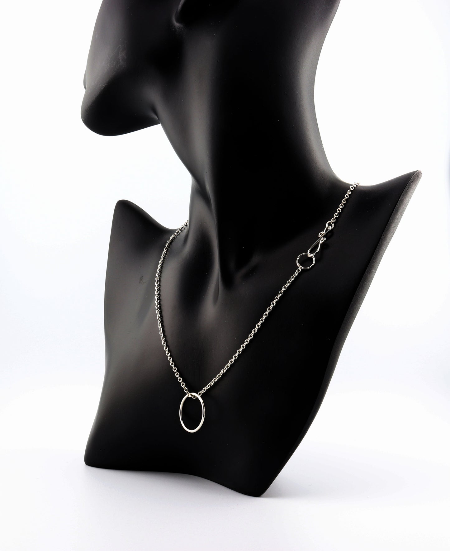 Elevate your jewelry collection with this handcrafted Open Circle Pendant Necklace, made from premium 935 Argentium® sterling silver. This versatile necklace is designed to be worn with or without the pendant and can be personalized with your favorite charms. Known for its hypoallergenic properties, tarnish resistance, and sustainability, 935 Argentium® silver is crafted from 100% recycled materials and has a higher silver content than traditional 925 sterling silver.