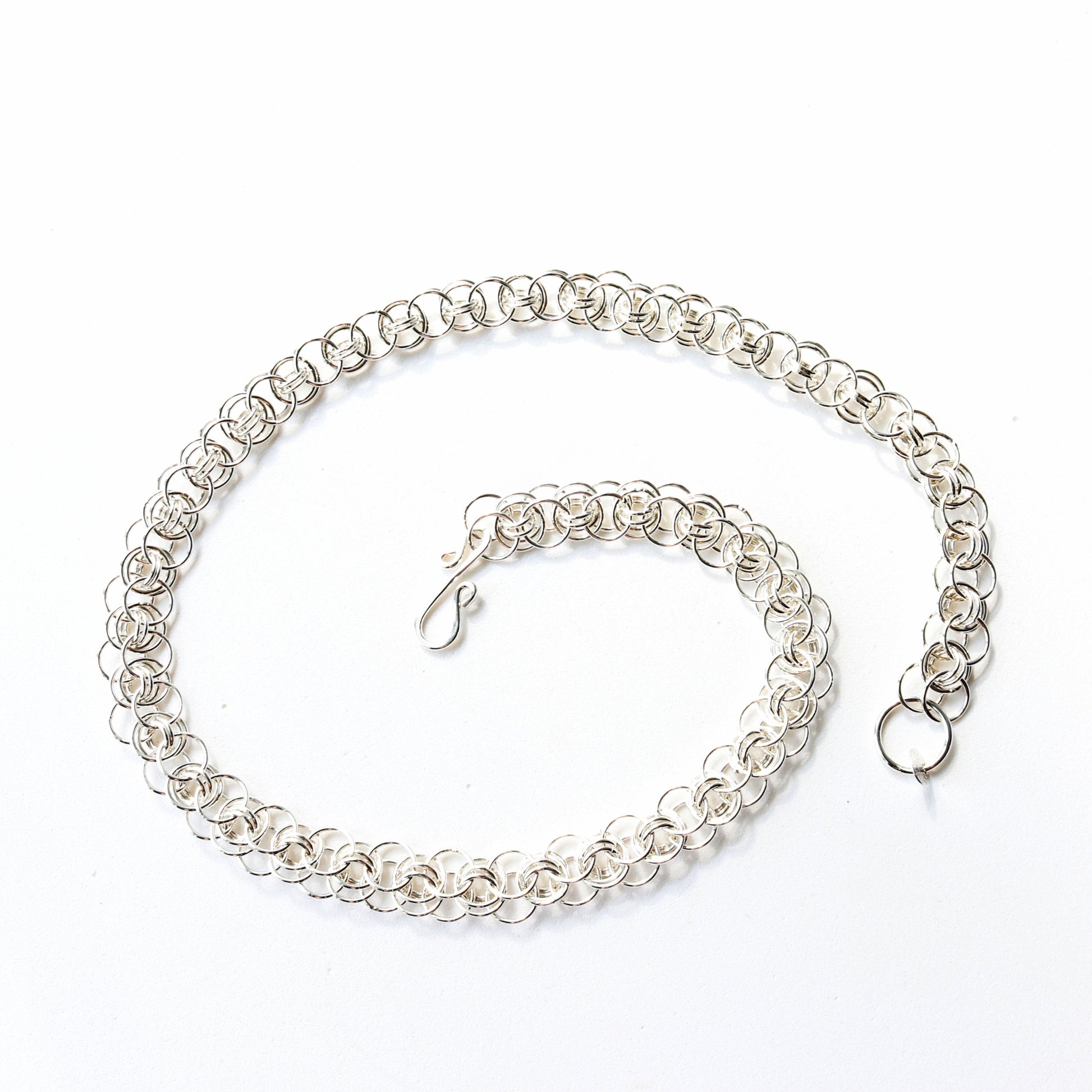 Close-up of helm weave necklace with s-hook clasp in tarnish-resistant Argentium silver.