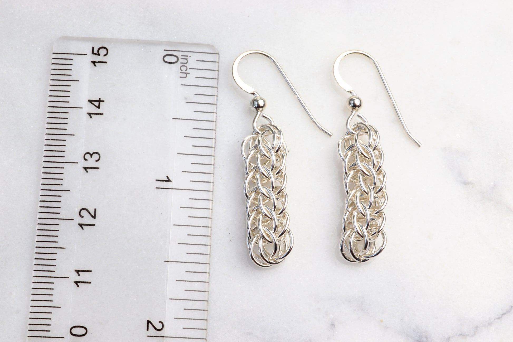 Our handcrafted solid silver dangle earrings, showcase a mesmerizing full Persian weave pattern, featuring interlocking links that create a captivating visual effect in premium sterling 935 Argentium® silver. The 935 Argentium® Silver ear wires, add a touch of elegance, ensure a comfortable and secure fit and are hypoallergenic. Light and comfortable with a drop length 1.5 inches