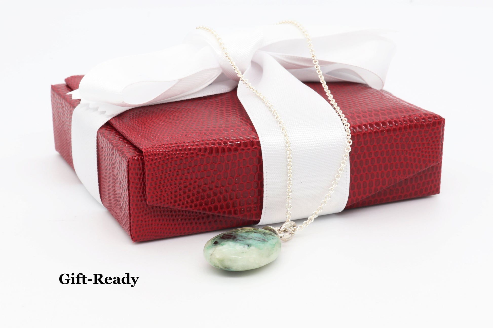 Teardrop pendant is gift ready in red box with white satin ribbon.