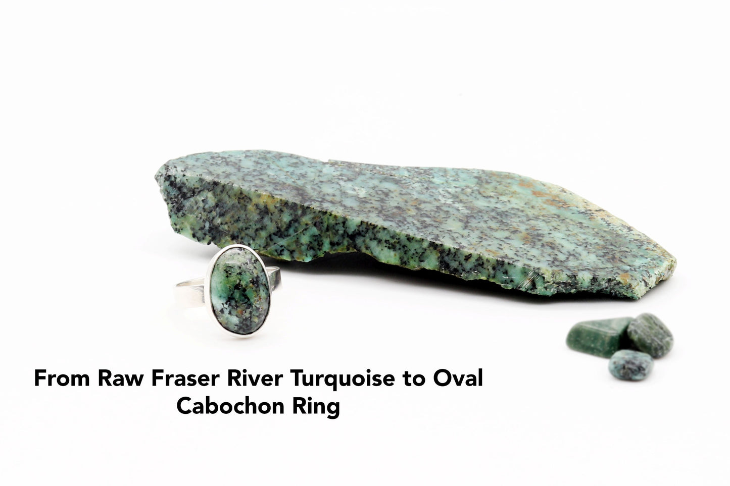 Raw Fraser River turquoise stone used to craft the oval cabochon ring on a white background.