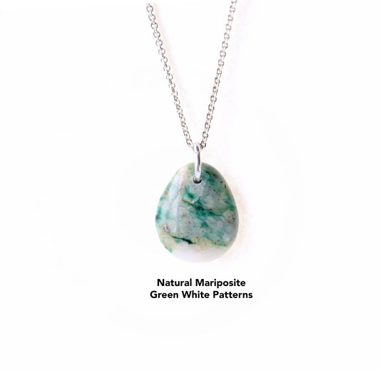This teardrop-shaped Mariposite gemstone pendant charm showcases a vivid blend of green and white patterns, handcut and polished in our Missouri studio. An Argentium silver chain is included.