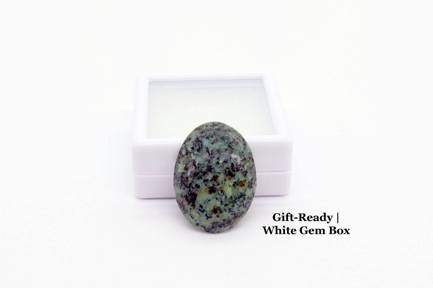 Gift Ready Fraser River Turquoise Cab next to white gem box included for storage or gifting.
