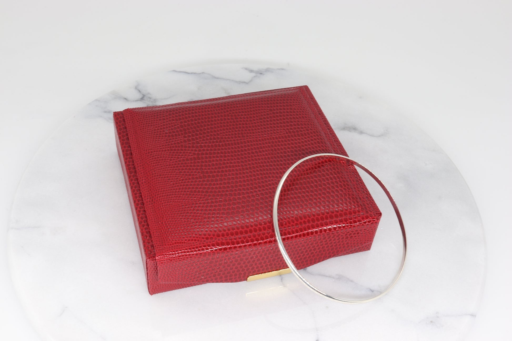 Bracelet comes packaged in a red faux leather gift box.