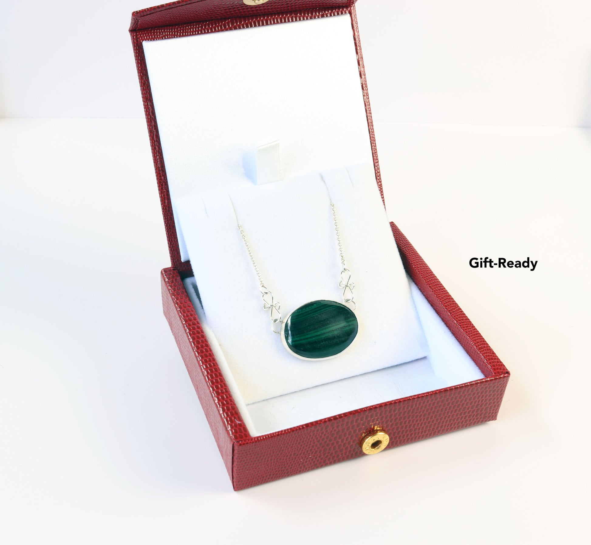 Malachite Pendant shown in red faux leather gift box.