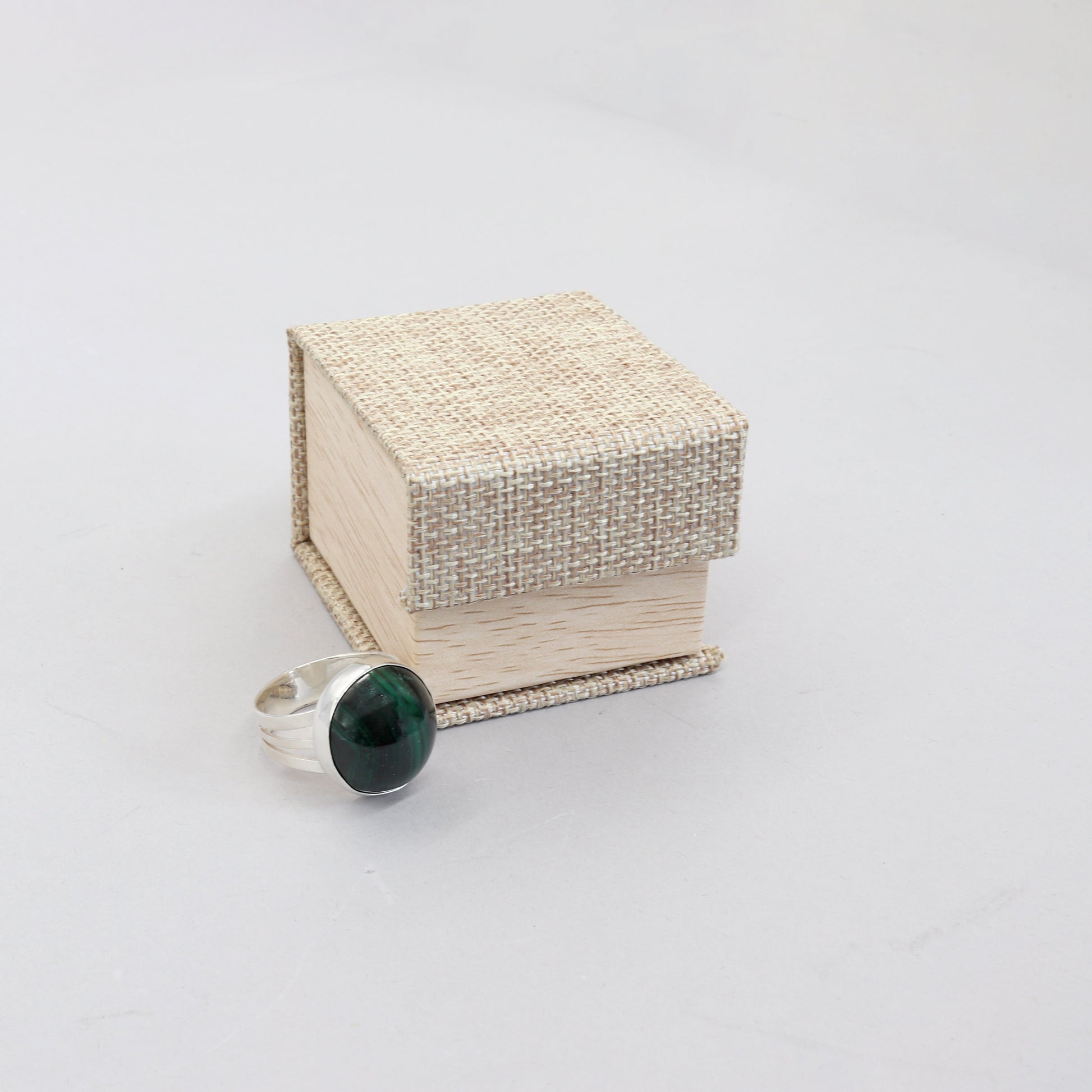 A handcrafted one-of-a-kind cabochon Malachite gemstone men's ring, handcut and polished in our Missouri studio. The ring is crafted from fine silver, and sterling Argentium® 935 Silver renowned for its resistance to tarnishing and its durable quality.  Ready to gift in an eco-friendly gift box.