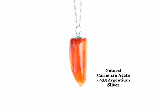 A one-of-a-kind  2.15 inch Carnelian Crystal Agate pendant, hand-cut and freeform polished into a unique pepper-shaped form, reminiscent of a small orange sweet pepper, to highlight its vibrant natural colors and patterns.  Suspended from a silver chain against a white background.