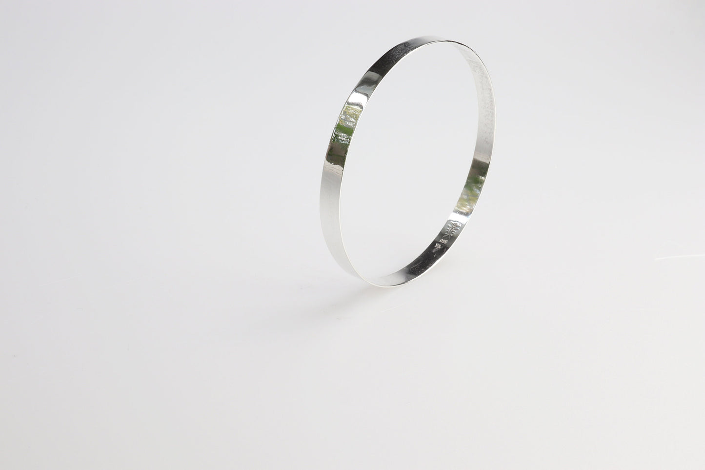 A high Flat Bangle Bracelet in tarnish resistant and hypoallergenic Argentium® 935 silver. Pair with other bracelets for that modern and sophisticated look.