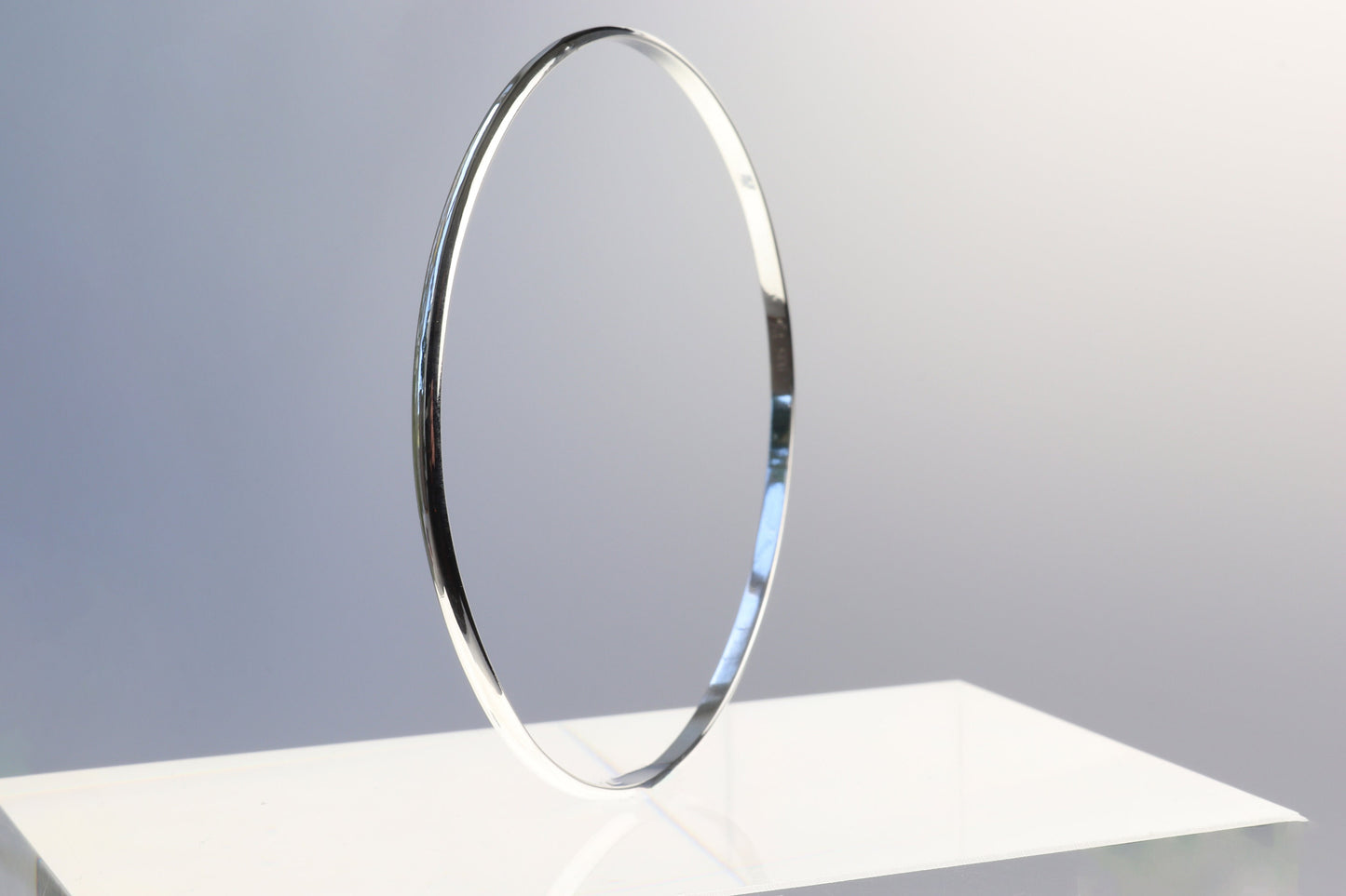 Handcrafted in our Missouri studio, this bangle features a high-polished finish, and is lightweight, comfortable and versatile. Its ideal width makes it perfect for stacking with other bracelets or wearing on its own.