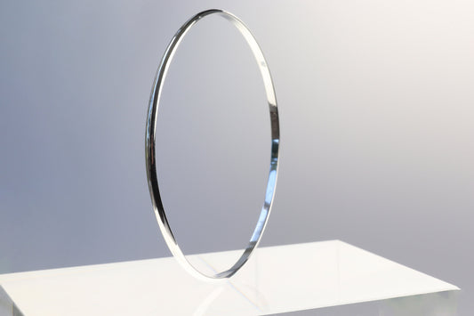 Handcrafted in our Missouri studio, this bangle features a high-polished finish, and is lightweight, comfortable and versatile. Its ideal width makes it perfect for stacking with other bracelets or wearing on its own.