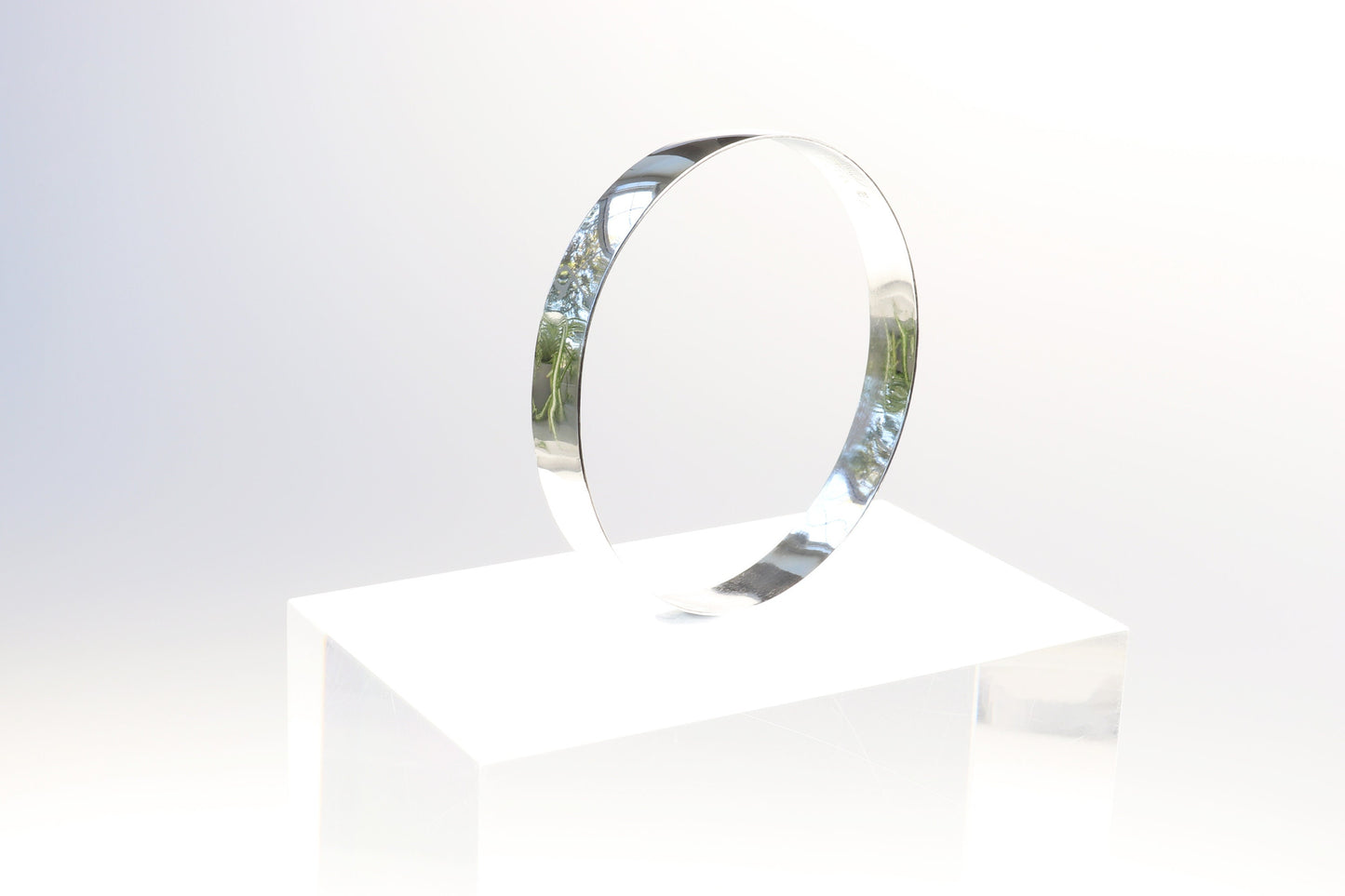 Artisan-Crafted in Our USA Studio, a 9mm Bangle Bracelet, Crafted from 935 Argentium Silver, Features a Subtle Beveled Design. Argentium 935, Known for Its Premium Tarnish Resistance and Hypoallergenic Properties, Makes it an Exceptional Addition to Your Personal Collection. Beveled edges can make it easier to slide the bracelet onto the wrist and remove it and adds a touch of elegance and sophistication to the design.