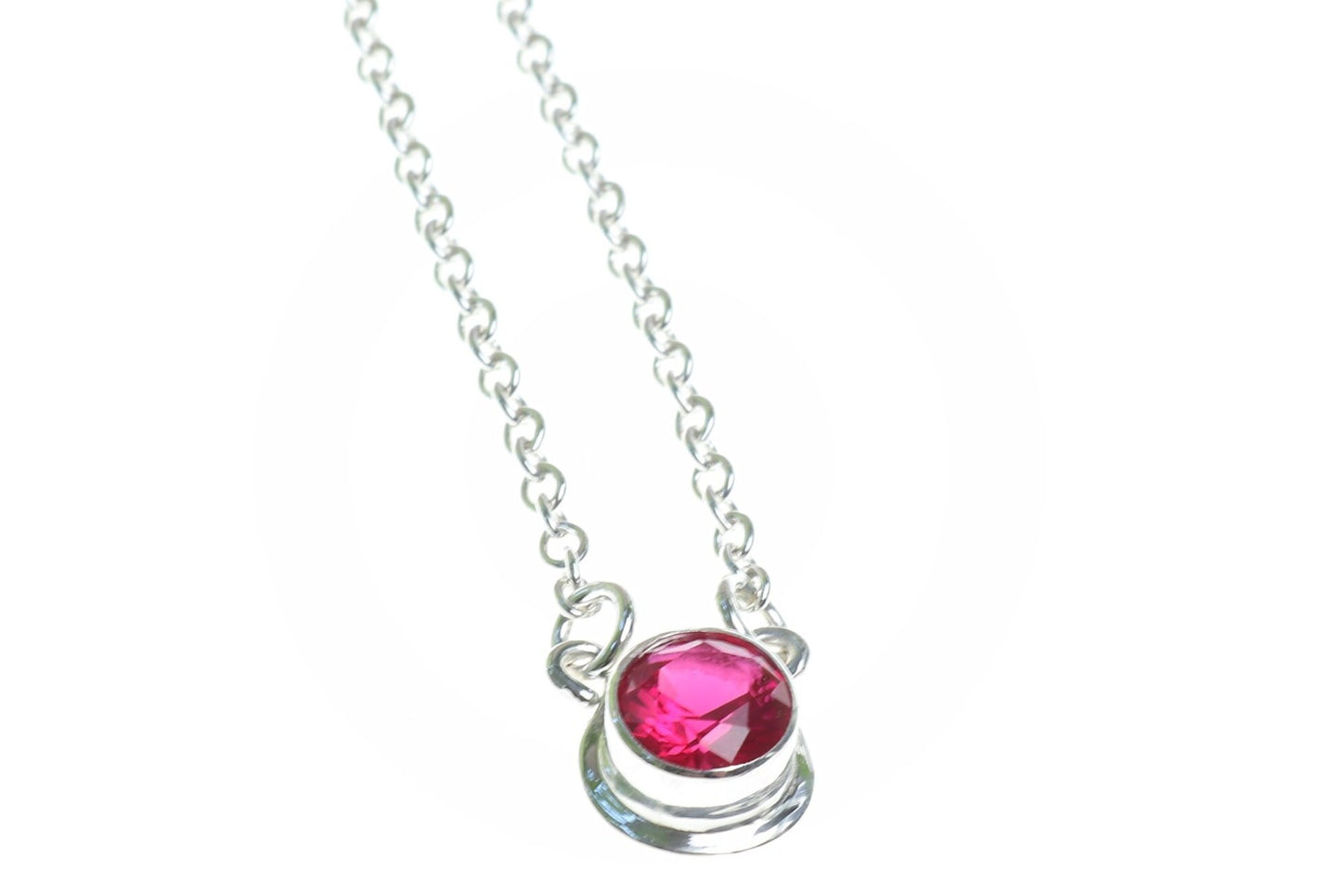 Handcrafted in our studio, a dainty and colorful lab-created 6mm Ruby. Set in solid sterling Argentium® 935 Silver, this elegant piece showcases the perfect combination of beauty and durability.
