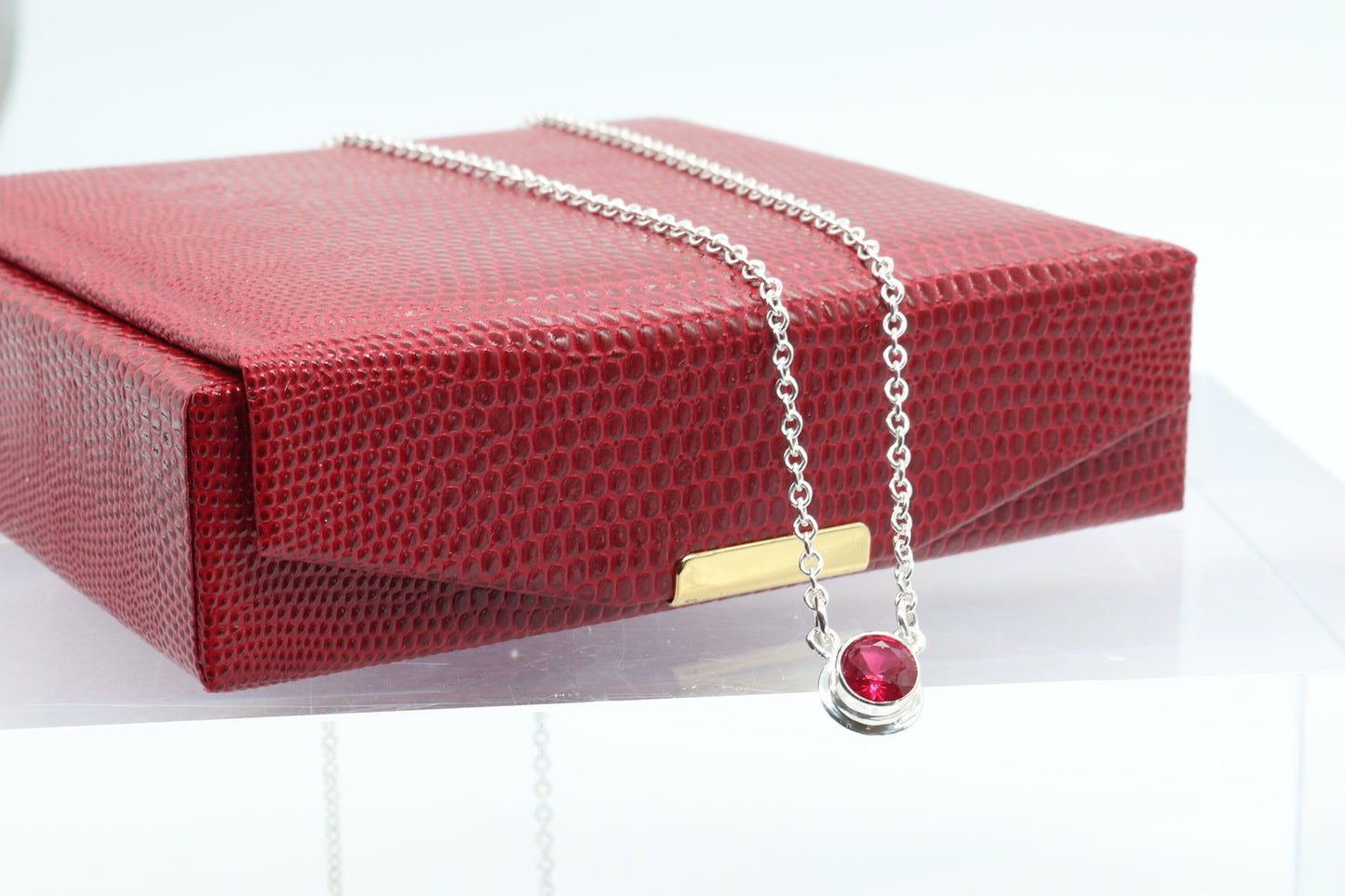 Handcrafted in our studio, a dainty and colorful lab-created 6mm Ruby. Set in solid sterling Argentium® 935 Silver, this elegant piece showcases the perfect combination of beauty and durability.