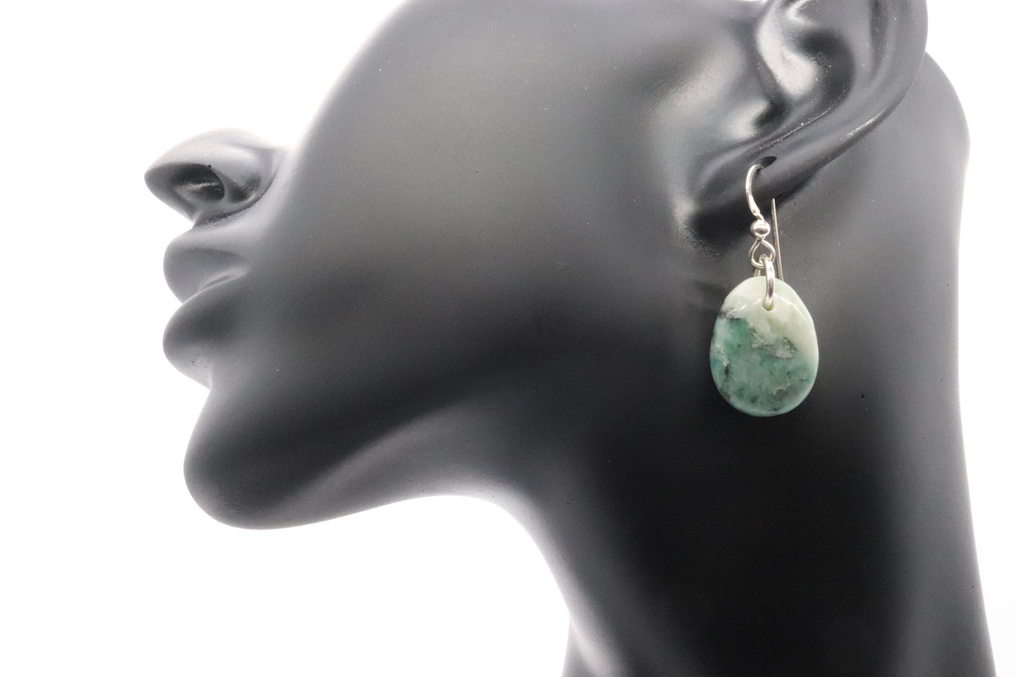Natural African Turquoise tear drop earrings, handcut and polished in our Missouri studio to reveal earthy patterns and hues of teal, green and creamy white.  Reminiscent of real turquoise, African Turquoise boasts its own unique patterns and variations, making every piece truly one-of-a-kind.   The sterling 935 Argentium® Silver ear wires, add a touch of elegance, ensure a comfortable and secure fit and are hypoallergenic.