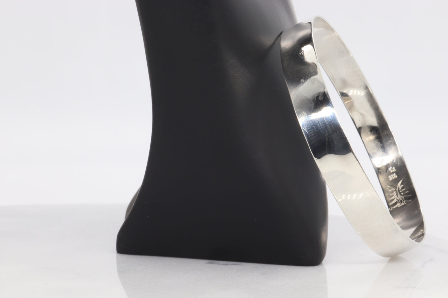 Artisan-Crafted in Our USA Studio, a 9mm Bangle Bracelet, Crafted from 935 Argentium Silver, Features a Subtle Beveled Design. Argentium 935, Known for Its Premium Tarnish Resistance and Hypoallergenic Properties, Makes it an Exceptional Addition to Your Personal Collection. Beveled edges can make it easier to slide the bracelet onto the wrist and remove it and adds a touch of elegance and sophistication to the design.