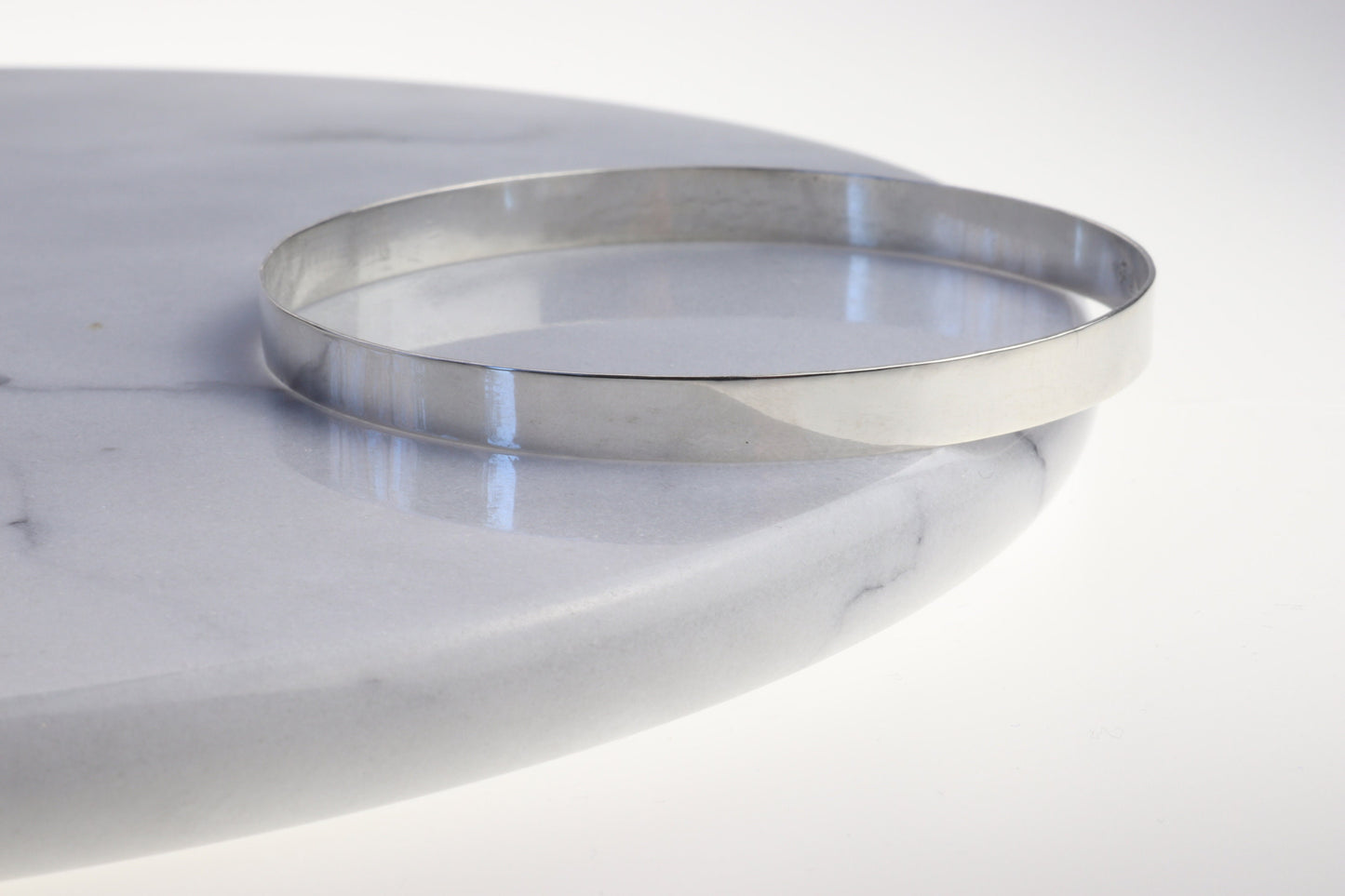 A high Flat Bangle Bracelet in tarnish resistant and hypoallergenic Argentium® 935 silver. Pair with other bracelets for that modern and sophisticated look.