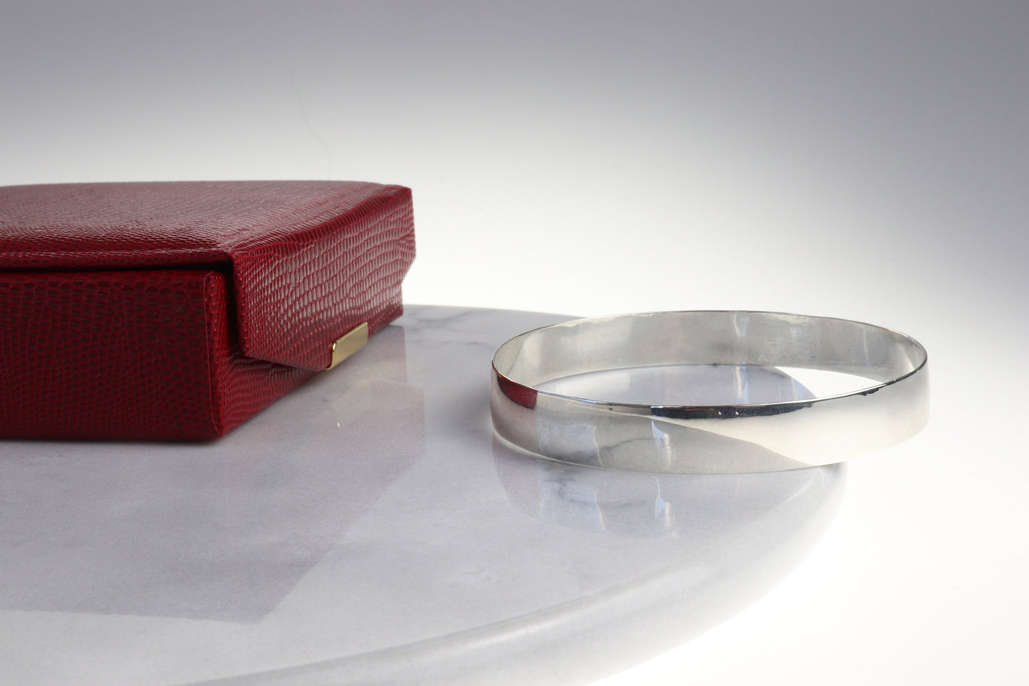 Artisan-Crafted in Our USA Studio, a 9mm Bangle Bracelet, Crafted from 935 Argentium Silver, Features a Subtle Beveled Design. Argentium 935, Known for Its Premium Tarnish Resistance and Hypoallergenic Properties, Makes it an Exceptional Addition to Your Personal Collection. Beveled edges can make it easier to slide the bracelet onto the wrist and remove it and adds a touch of elegance and sophistication to the design.