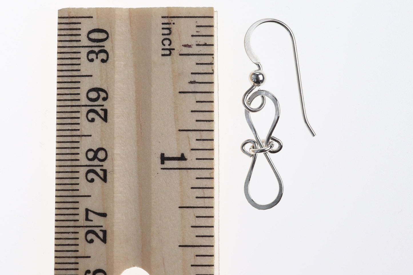 Introducing our exquisite handcrafted Infinity Bow Shaped Earrings, meticulously created in our USA Studio. These stunning earrings feature a beautiful hammered finish made with the finest quality sterling 935 Argentium silver, known for its hypoallergenic and tarnish-resistant properties.
Light and comfortable our earrings are designed with .032 inch ear wires to ensure a comfortable fit.
Each pair comes carefully packaged in a charming gift box.
Drop length of earrings is 1.625 inches