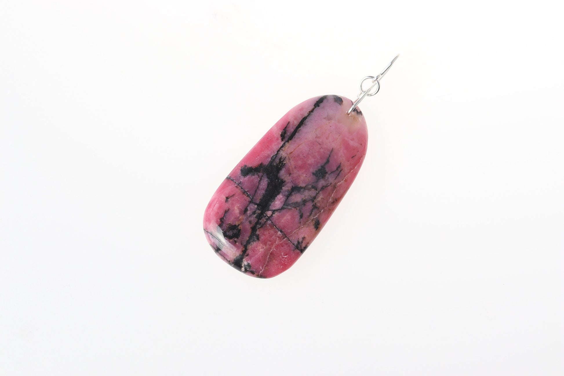 A polished Rhodonite pendant on both sides and features a handcrafted infinity bow-shaped bail made from hypoallergenic, tarnish-resistant Argentium® 935 silver.