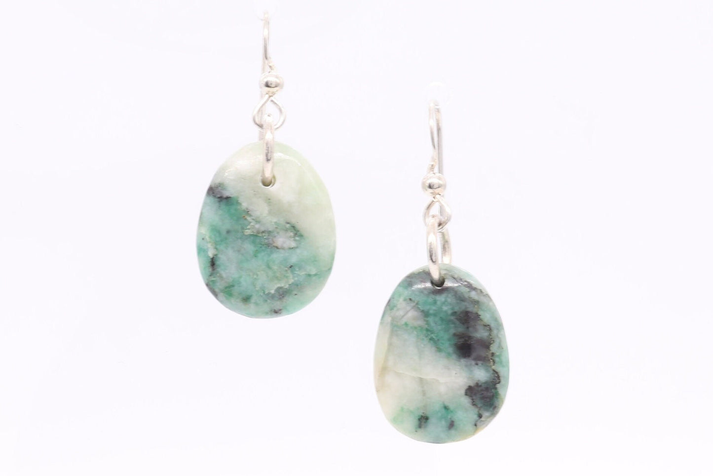 Natural African Turquoise tear drop earrings, handcut and polished in our Missouri studio to reveal earthy patterns and hues of teal, green and creamy white. Reminiscent of real turquoise, African Turquoise boasts its own unique patterns and variations, making every piece truly one-of-a-kind. The sterling 935 Argentium® Silver ear wires, add a touch of elegance, ensure a comfortable and secure fit and are hypoallergenic.