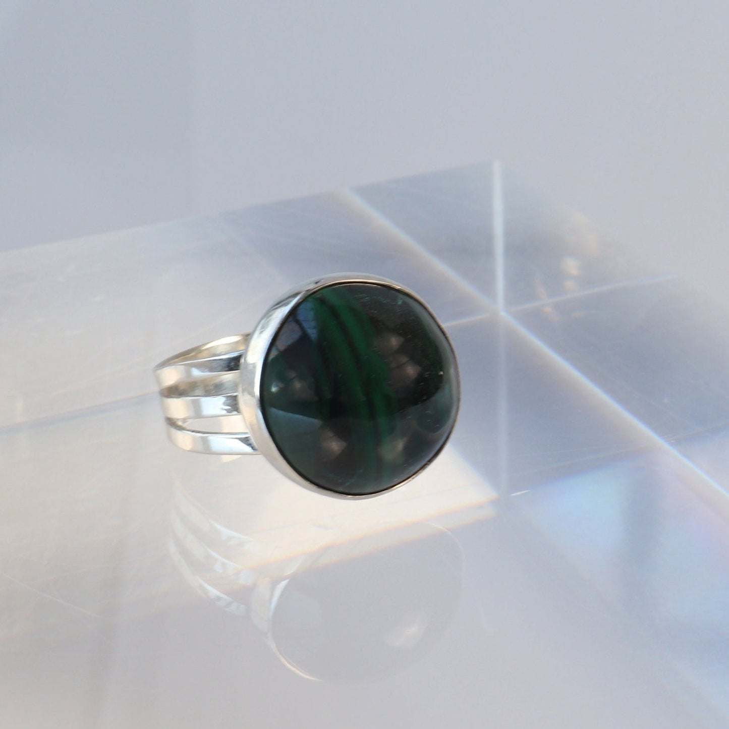 A handcrafted one-of-a-kind cabochon Malachite gemstone men's ring, handcut and polished in our Missouri studio. The ring is crafted from fine silver, and sterling Argentium® 935 Silver renowned for its resistance to tarnishing and its durable quality.