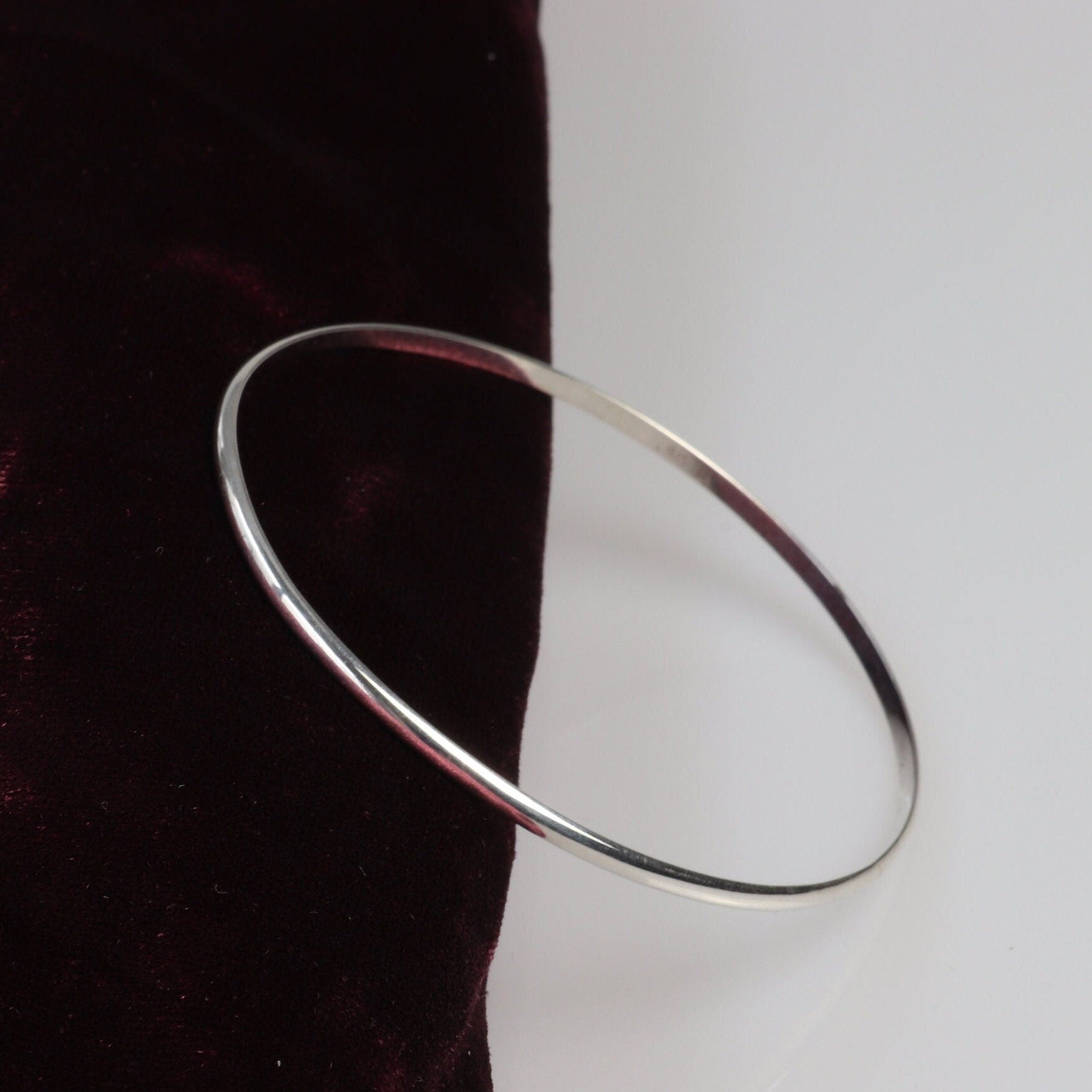 Handcrafted in our Missouri studio, this bangle features a high-polished finish, and is lightweight, comfortable and versatile. Its ideal width makes it perfect for stacking with other bracelets or wearing on its own.