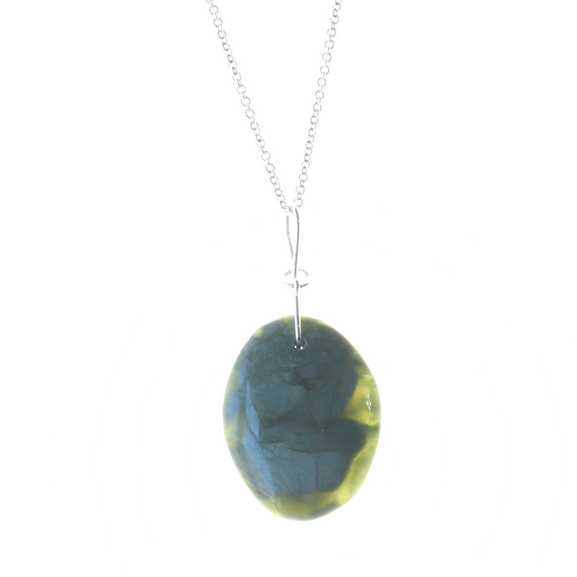 A California Jade gemstone pendant. Handcut and polished to showcase its unique translucent qualities, green hues and striking patterns on both sides. The pendant is designed with an original infinity bow shaped wire bail made from sterling Argentium® 935 Silver that is tarnish resistance and has a remarkable shine. The complete the look a complementary 935 Argentium silver chain is included.