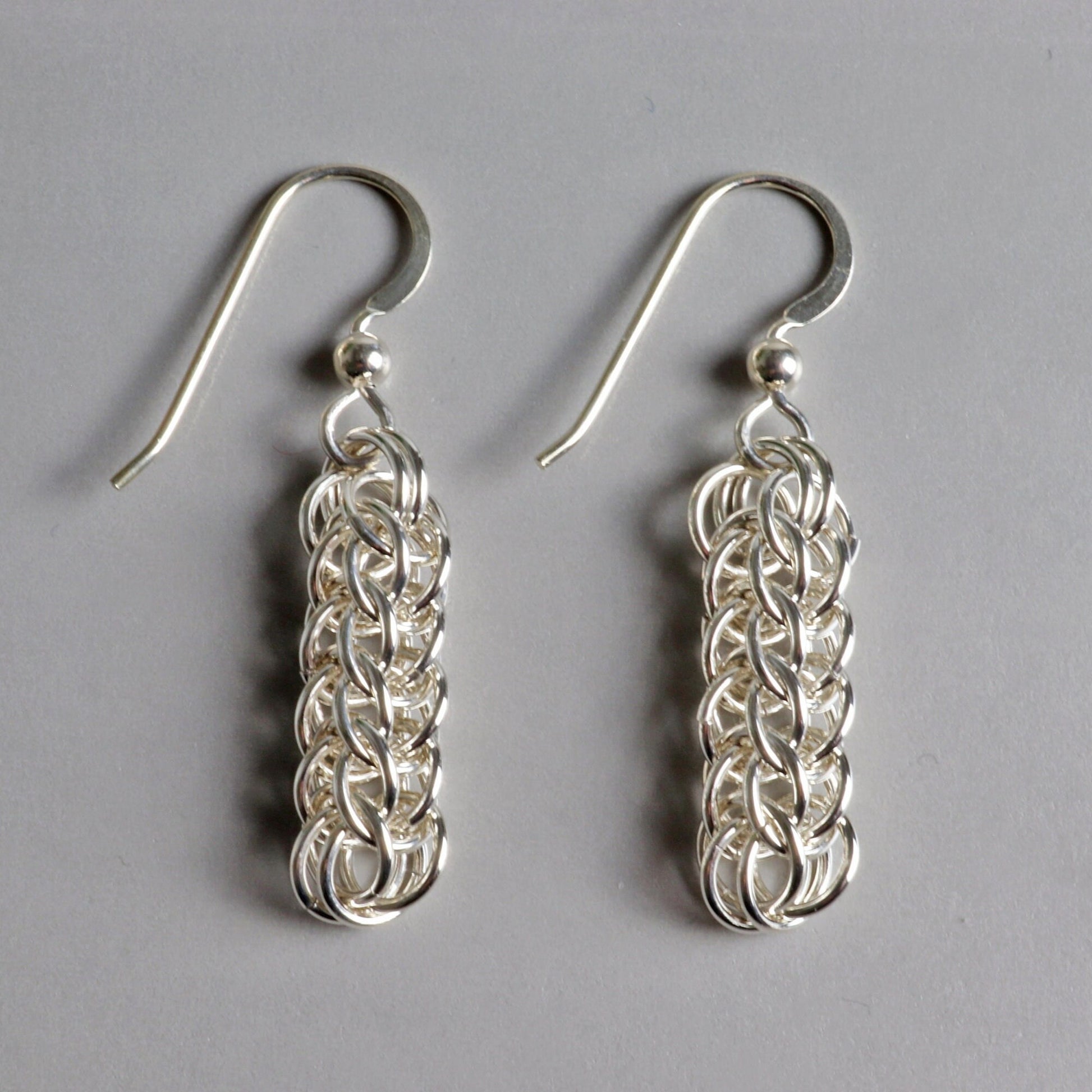 Our handcrafted solid silver dangle earrings, showcase a mesmerizing full Persian weave pattern, featuring interlocking links that create a captivating visual effect in premium sterling 935 Argentium® silver. The 935 Argentium® Silver ear wires, add a touch of elegance, ensure a comfortable and secure fit and are hypoallergenic. Light and comfortable with a drop length 1.5 inches