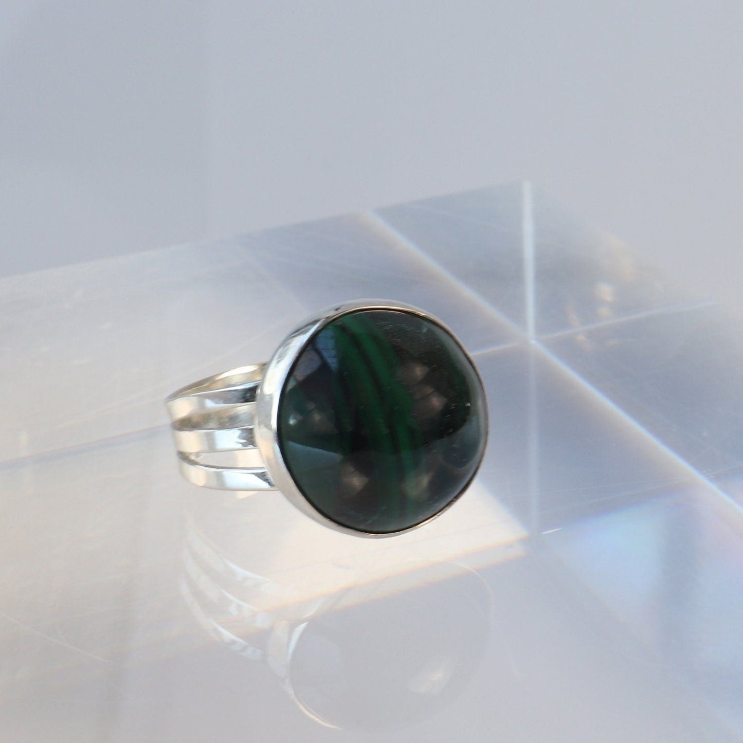 A handcrafted one-of-a-kind cabochon Malachite gemstone men's ring, handcut and polished in our Missouri studio. The ring is crafted from fine silver, and sterling Argentium® 935 Silver renowned for its resistance to tarnishing and its durable quality.