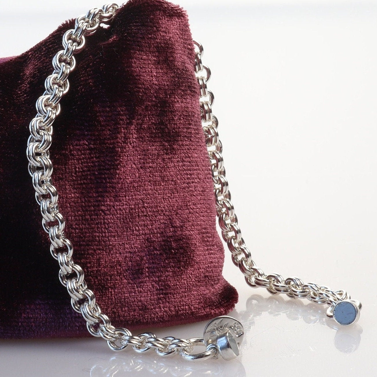 A handcrafted double cable chain bracelet in solid sterling 935 Argentium solid silver. This eye-catching double cable weave bracelet features a magnetic clasp that holds securely, yet opens and closes easily. sterling Argentium 935 is known for its tarnish resistant hypoallergenic qualities and contains more pure silver than the typical .925 Sterling silver.