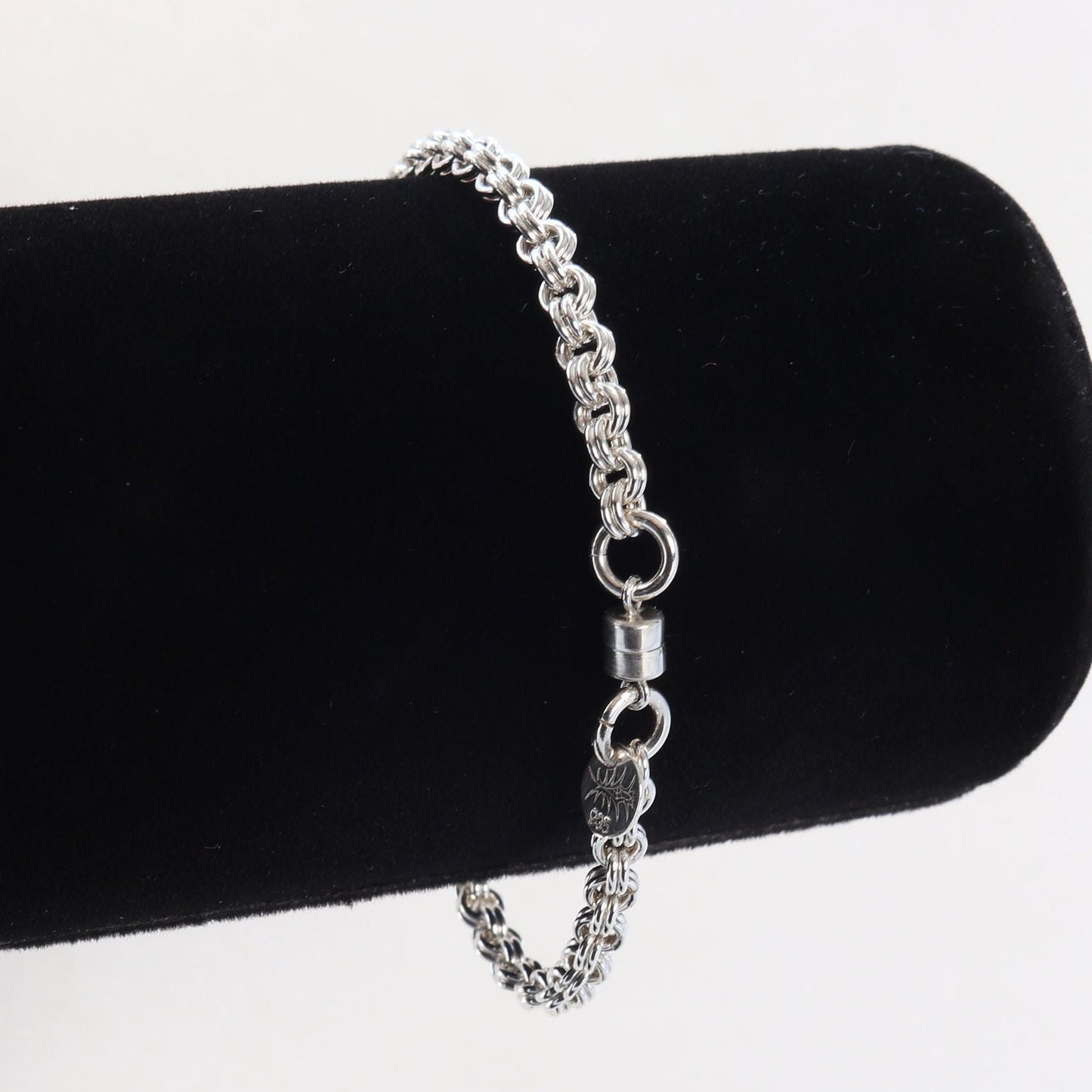 A handcrafted double cable chain bracelet in solid sterling 935 Argentium solid silver. This eye-catching double cable weave bracelet features a magnetic clasp that holds securely, yet opens and closes easily. sterling Argentium 935 is known for its tarnish resistant hypoallergenic qualities and contains more pure silver than the typical .925 Sterling silver.