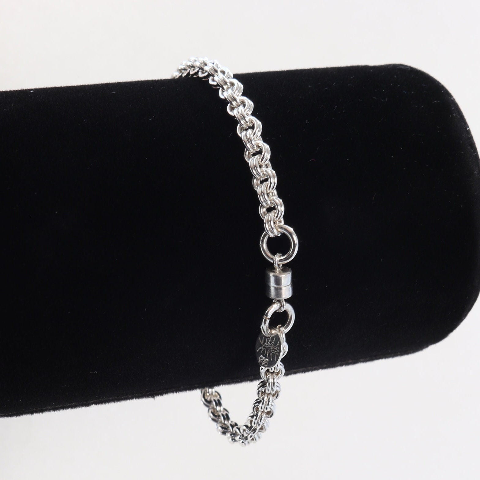 A handcrafted double cable chain bracelet in solid sterling 935 Argentium solid silver. This eye-catching double cable weave bracelet features a magnetic clasp that holds securely, yet opens and closes easily. sterling Argentium 935 is known for its tarnish resistant hypoallergenic qualities and contains more pure silver than the typical .925 Sterling silver.