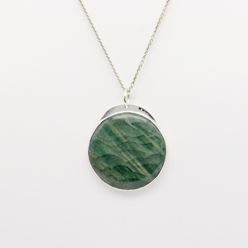Introducing our handcrafted 1.88 inch Arizona Green Lizard Gemstone Pendant Necklace, in Sterling 935 Argentium Silver. The gemstone was handcut and polished (in our Missouri Studio) into a smooth cabochon to showcase the stunning green hues and natural patterns of the stone. To complete the look a complementary sterling 935 Argentium chain is included.