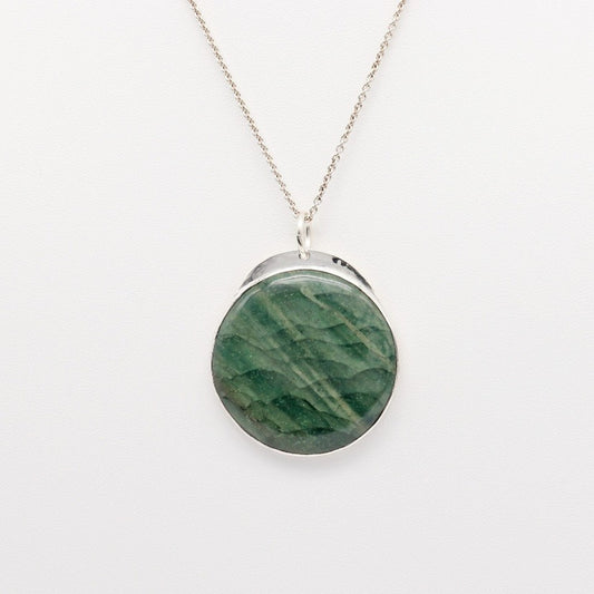 Introducing our handcrafted 1.88 inch Arizona Green Lizard Gemstone Pendant Necklace, in Sterling 935 Argentium Silver. The gemstone was handcut and polished (in our Missouri Studio) into a smooth cabochon to showcase the stunning green hues and natural patterns of the stone. To complete the look a complementary sterling 935 Argentium chain is included.