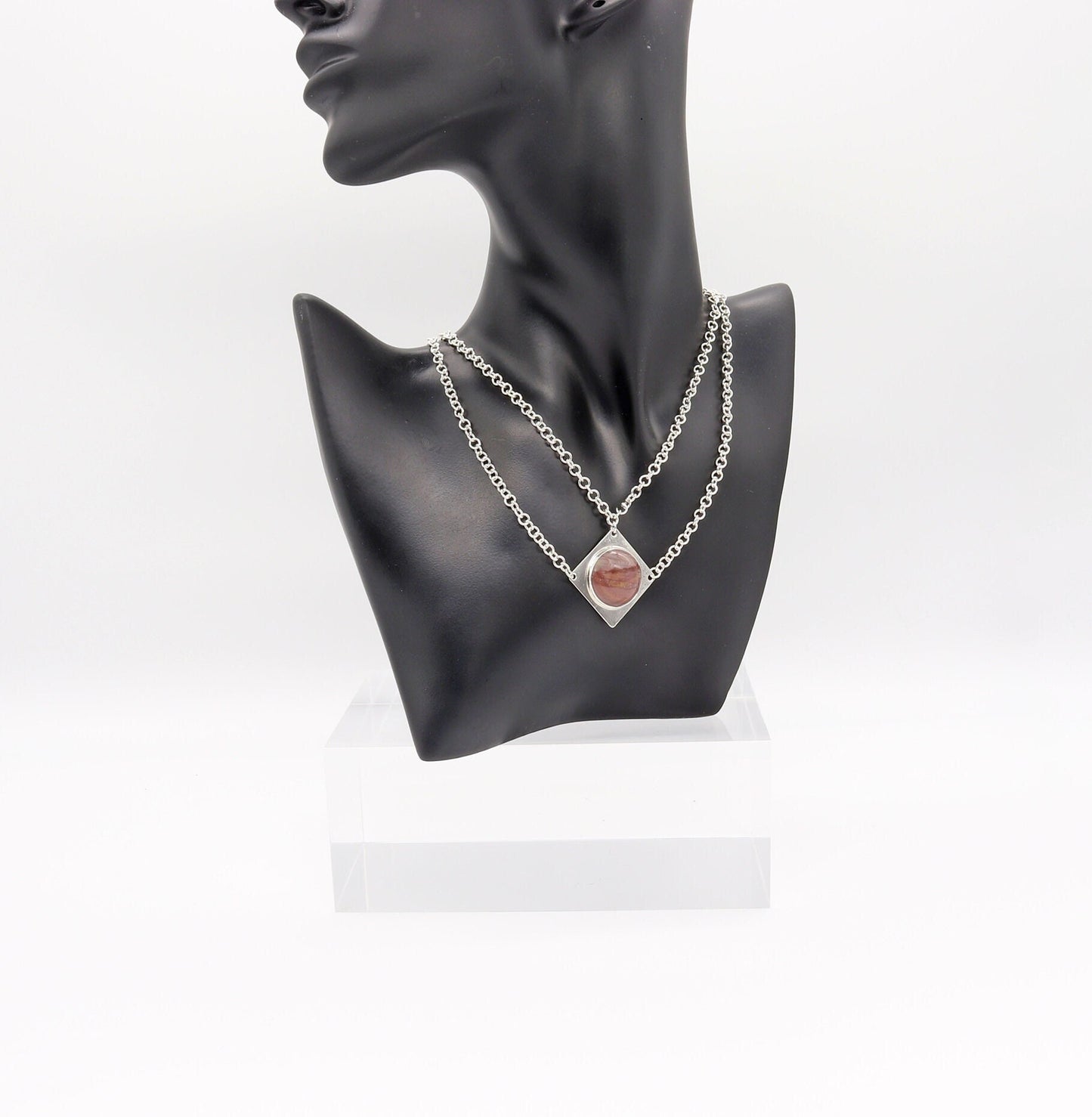 Handcrafted in our studio is a uniquely elegant creation: the Petrified Rainbow Wood Pendant set in sterling Argentium® 935 Silver, accompanied by a custom dual cable chain necklace with S hook Clasp for easy wearing.