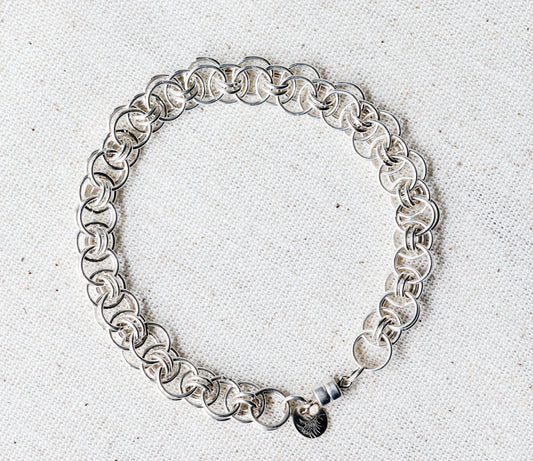 Argentium® Silver Helm Weave Chainmail Bracelet – 6mm or 8mm, Magnetic Clasp, Tarnish-Resistant, Handmade in Missouri shown on natural linen background.
