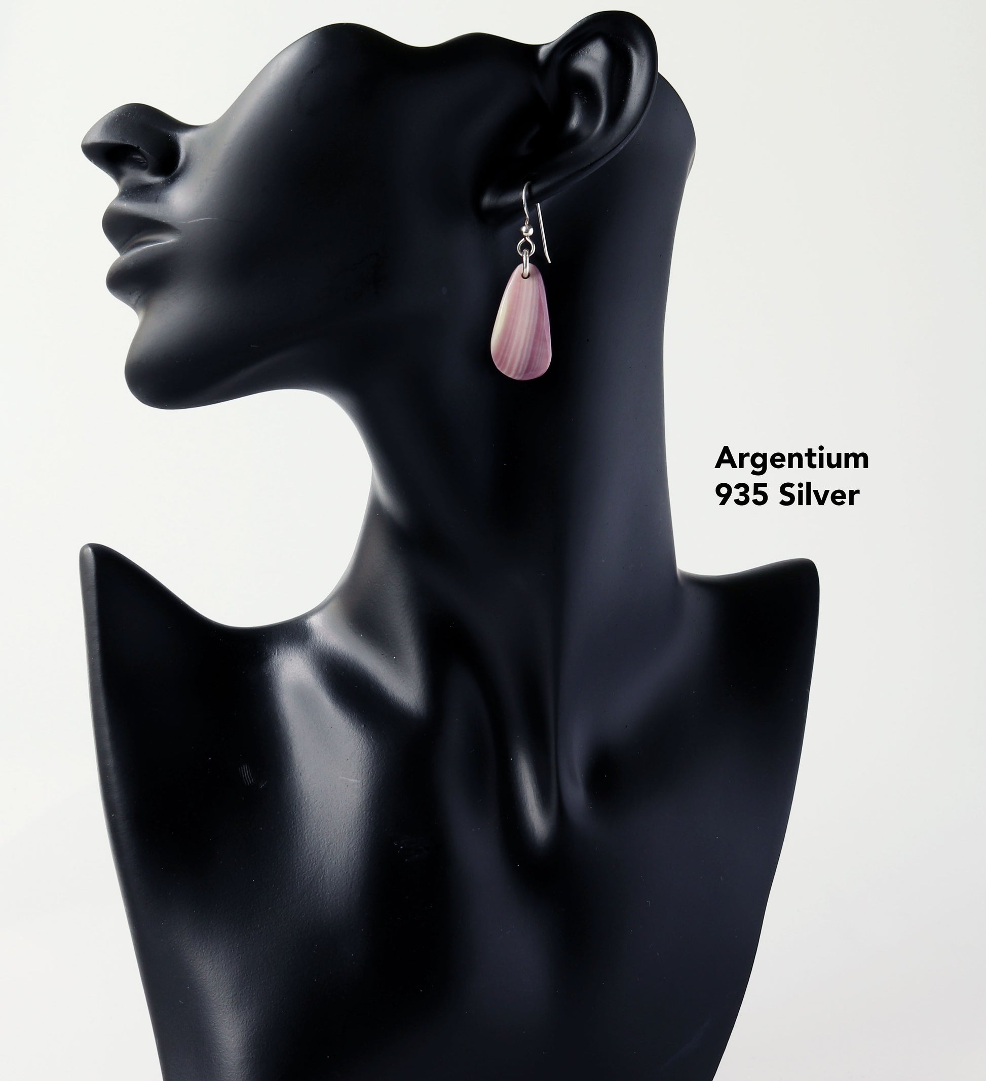 Introducing this exquisite pair of Lavender and Cream earrings in sterling Argentium 935 silver.  Shown on a black resin boutique jewelry manniquin against a light gray background.