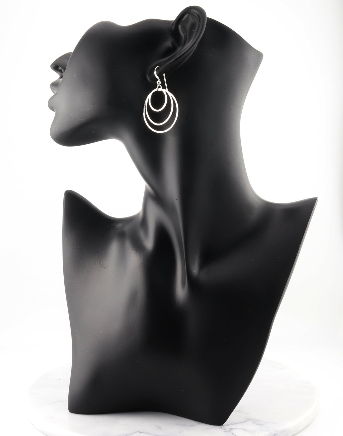 Discover the perfect blend of sustainability and style with our handcrafted hammered hoop earrings. Made from 100% recycled Argentium® 935 silver, these tarnish-resistant earrings are designed to last while maintaining their brilliant finish.