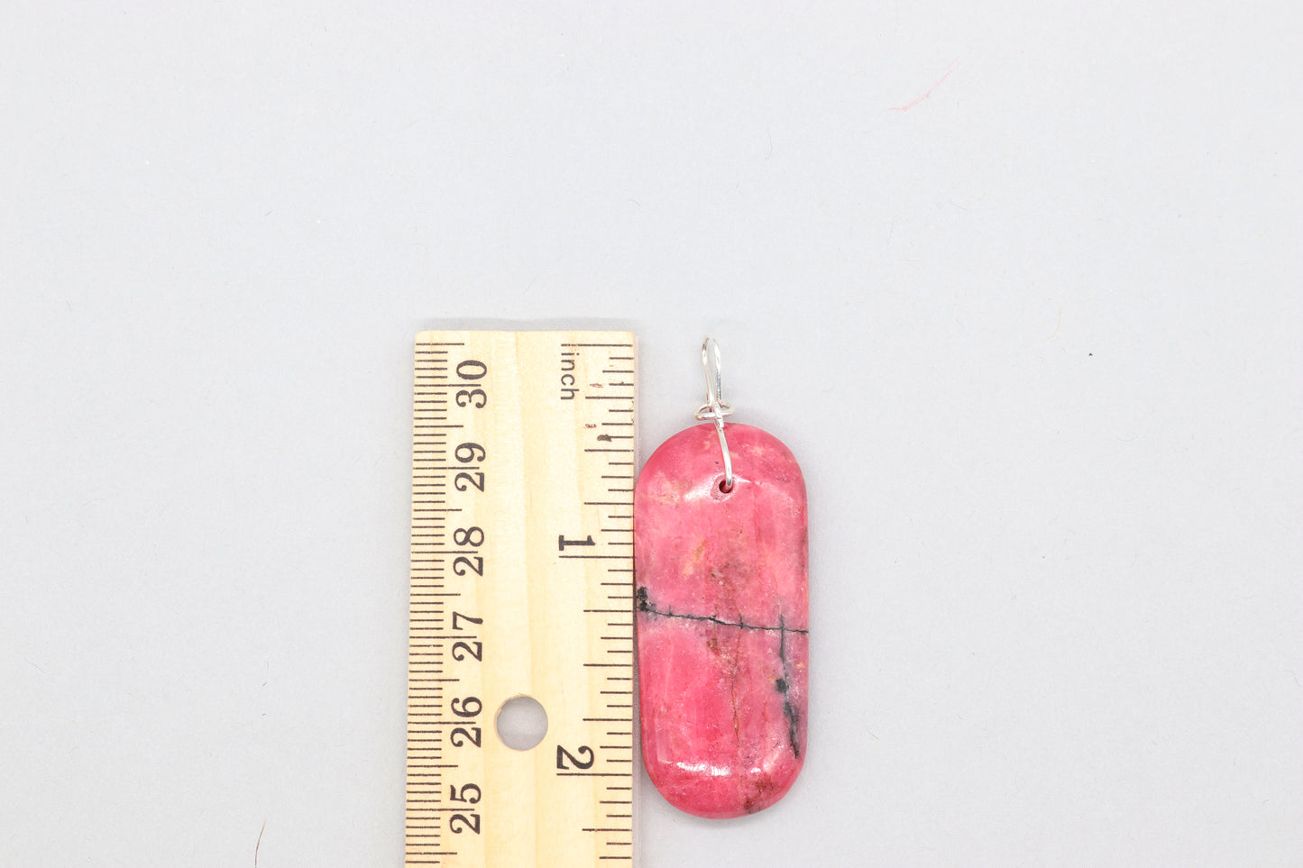 2.26 inch Pink Rhodonite Pendant with Argentium 935 custom wire bail shown next to ruler for measurement verification.