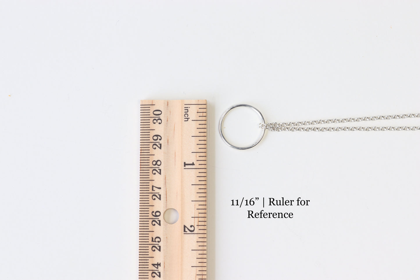 Circle Pendant Neckace shown next to ruler to illustrate the side of pendant circle 11/16" or 0.687" circle.